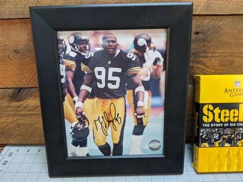 Greg Lloyd Autograph Photograph and Steelers DVDs - Bid On Estates Auction Services