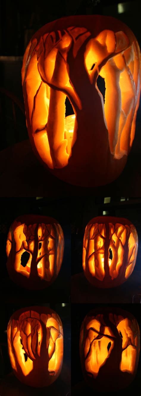 pumpkin carved to look like a tree with leaves and branches on it, all lit up