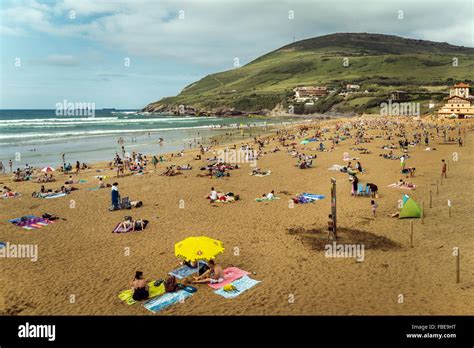 Crowd of people sunbathing on the beach Arena Bilbao, Spain Stock Photo ...