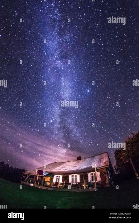 Night landscape with colorful Milky Way stars over the trees and coutry ...