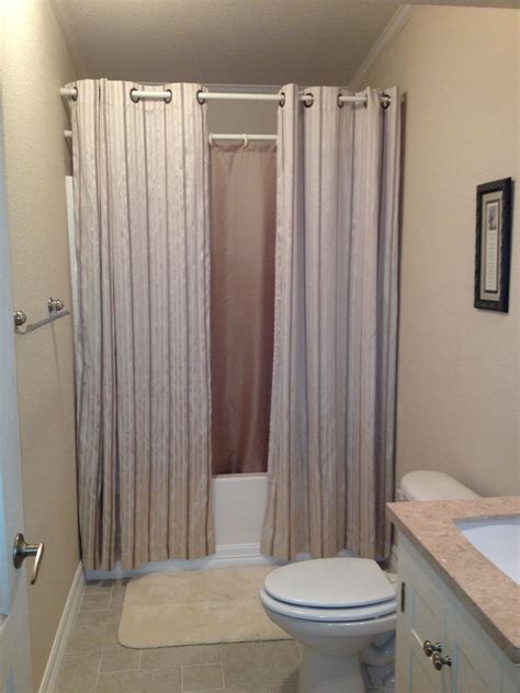 hanging shower curtains to make small bathroom look bigger | Cool shower curtains, Small ...