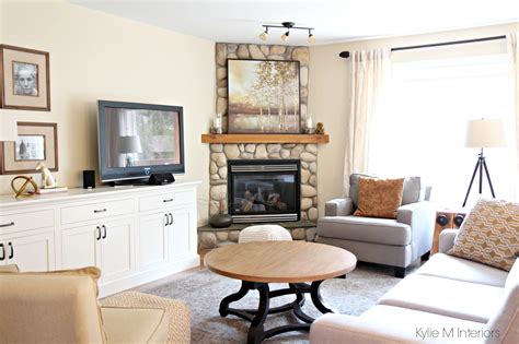 South west facing living room with stone corner fireplace, furniture, home decor and custom tv stand