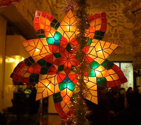 Stars of hope on fifth capiz shell christmas lantern parol display at the philippine center ...