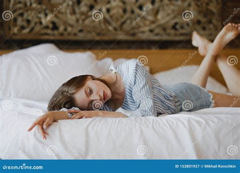 Young Sweet Girl Lying on Bed Stock Image - Image of neat, adult: 153801927