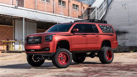 Lifted GMC Yukon With Chrome Red Vinyl Wrap — CARiD.com Gallery