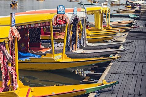 Premium Photo | Dal lake at sunset time. Shikara boats on the water at ...