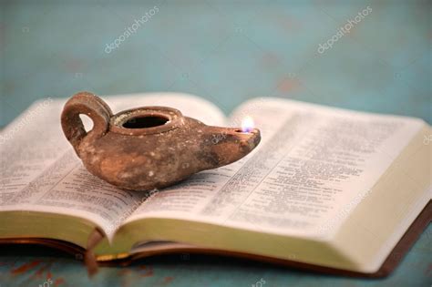 Ancient Oil Lamp on Open Bible Stock Photo by ©ginosphotos1 124954460