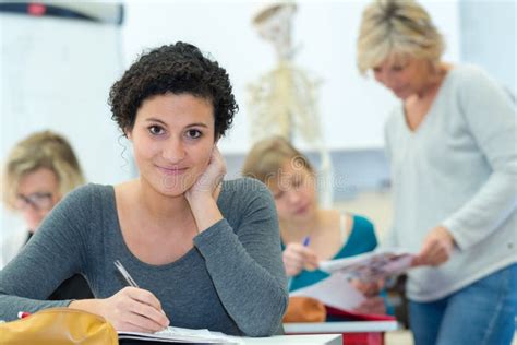 Happy student in classroom stock image. Image of class - 244998817