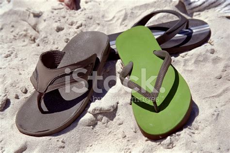 Pile Of Men's Flip-Flops On The Beach Stock Photo | Royalty-Free | FreeImages