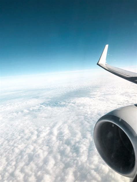 Photo of Airplane Flying Above Clouds · Free Stock Photo