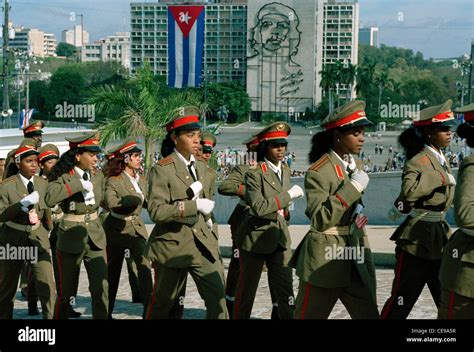 Cuban youth in military uniforms march during festivities on the anniversary of Jose Marti (1853 ...