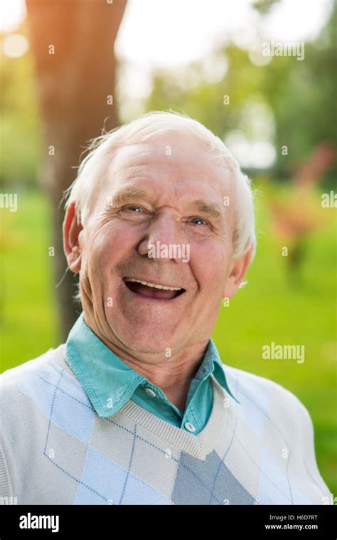 Old man laughing Stock Photo - Alamy