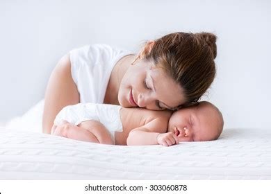 Young Mother Hugging Her Newborn Child Stock Photo 303060878 | Shutterstock