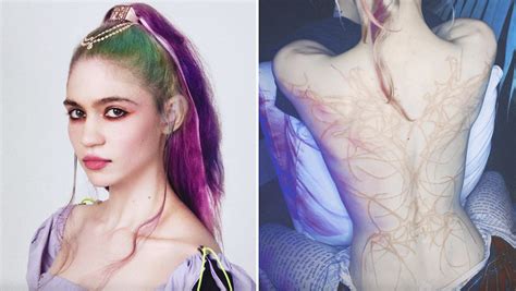 Grimes Shows Off New Tattoo of "Beautiful Alien Scars"