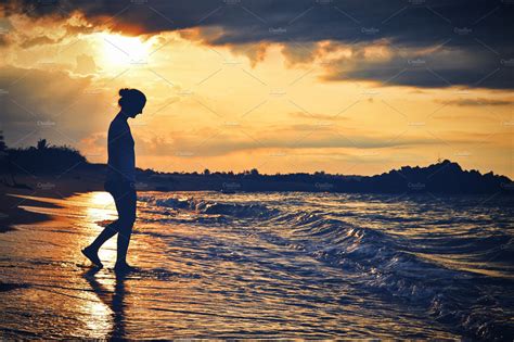 Sunset walk on the beach | Nature Stock Photos ~ Creative Market