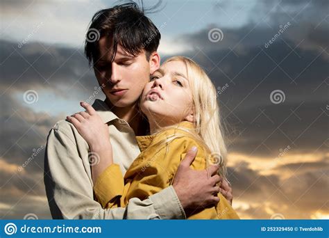 Young Couple in Love Hug Each Other on Sunset. Love Story. Stock Photo - Image of young, outdoor ...