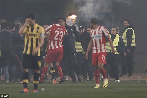 Olympiacos' quarter-final with AEK abandoned after an 89th minute goal sparks more crowd trouble ...