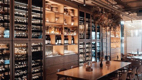 Modern restaurant with wine cellar in daylight · Free Stock Photo