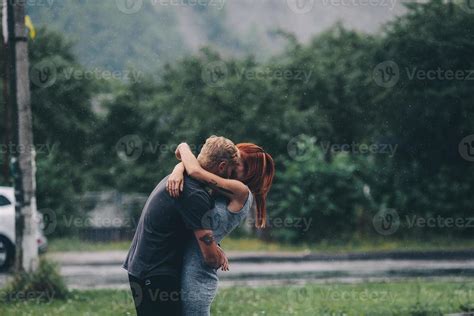 beautiful couple hugging in the rain 11781577 Stock Photo at Vecteezy