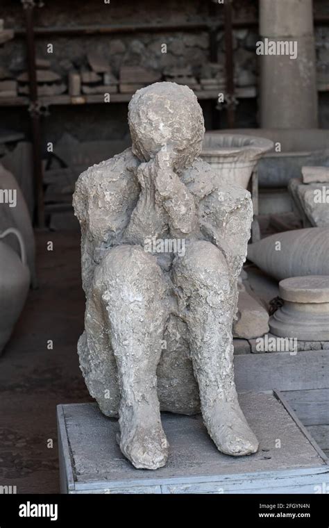 Human body plaster cast, ancient victim of the Vesuvius volcano eruption at Mensa Ponderaria in ...