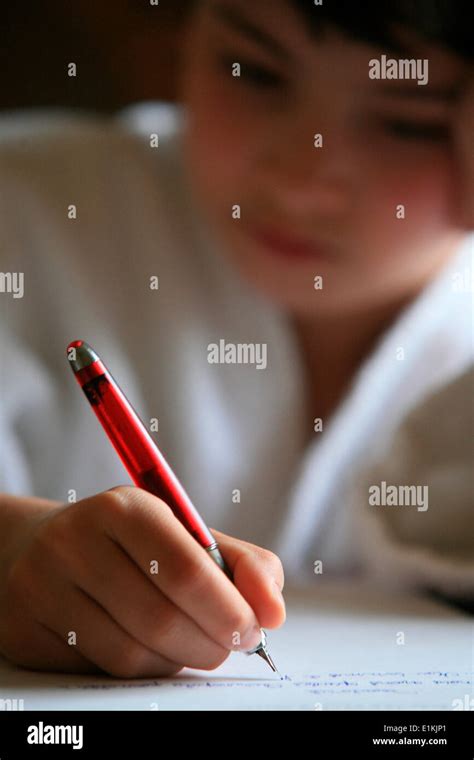 Boy writing a letter Stock Photo - Alamy