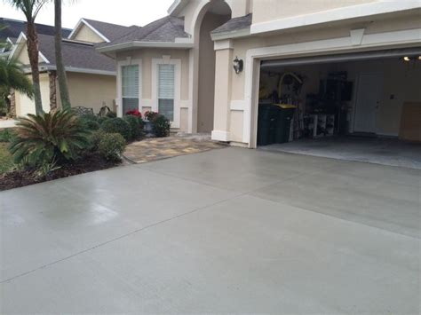 Stunning remodeled concrete driveway! | Painted concrete floors, House exterior, Patio