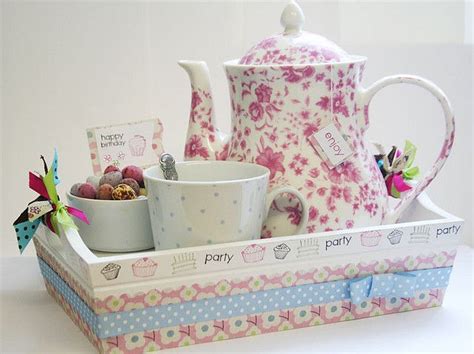 a tea set is sitting on a tray