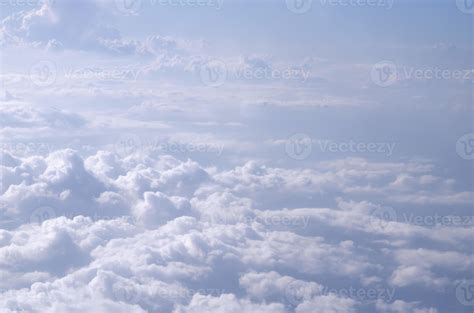 Beautiful cloudy sky from aerial view background. Airplane view above clouds. Sky and cloud ...