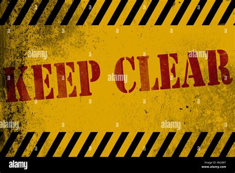 Keep Clear sign yellow with stripes Stock Photo - Alamy