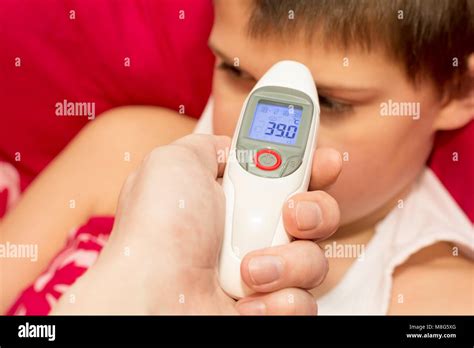 Sick person thermometer hi-res stock photography and images - Alamy