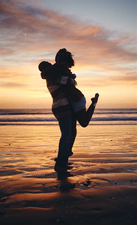 Silhouette couple, sunset beach love and hug on honeymoon, summer tropical vacation and ...