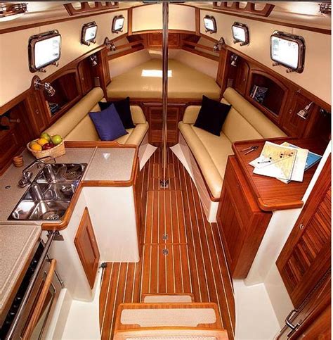 the inside of a boat with wood flooring