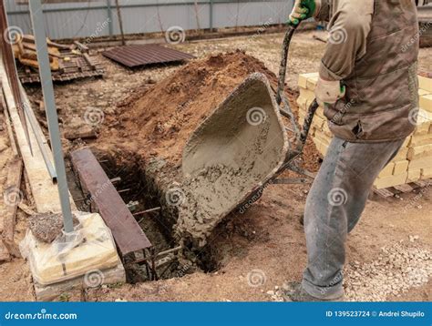 Concrete in a Wheelbarrow at a Construction Site Stock Photo - Image of ...