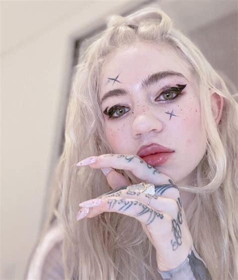 Grimes Debuts New Gnarly White-Ink “Alien Scars” Full Back Tattoo