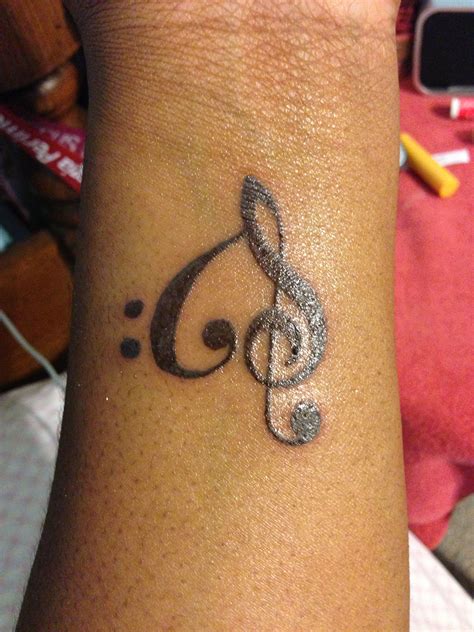 Treble clef and Bass clef tattoo Small Symbol Tattoos, Small Tattoo Placement, Small Tattoos For ...