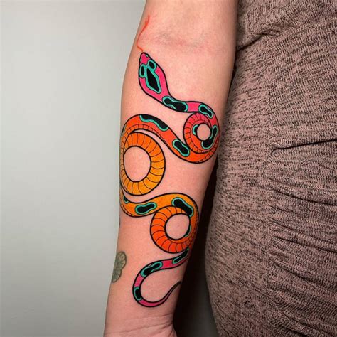 Colorful snake tattoo done on the inner forearm.