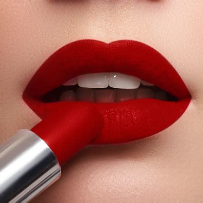 Extreme Close Up On Model Applying Dark Red Lipstick Makeup Stock Photo - Download Image Now ...