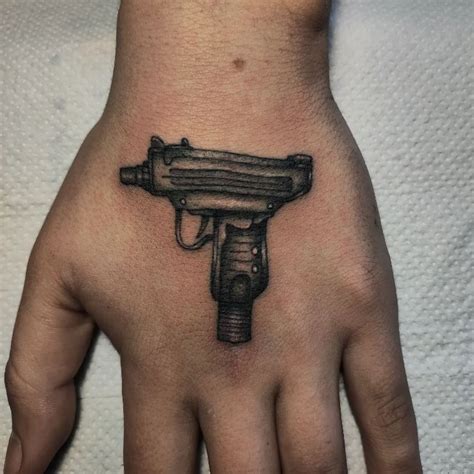 Top 147 + Revolver hand tattoo - Spcminer.com