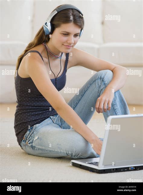 Girl typing on laptop Stock Photo - Alamy