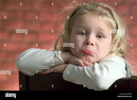 Portrait of a Caucasian little girl pouting and making a face for the camera Stock Photo - Alamy