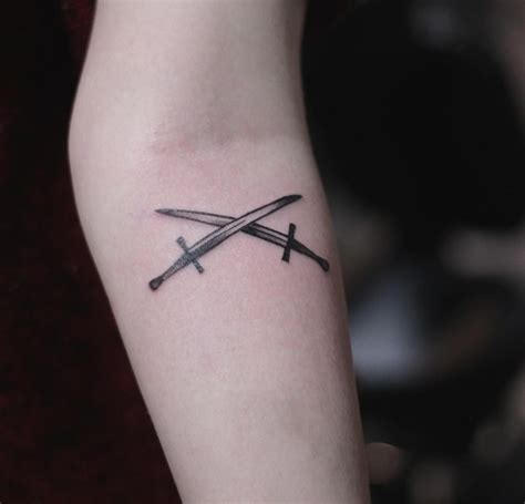 Two crossed swords tattoo on the forearm done by Kristian Kriistian | Sword tattoo, Tattoos ...