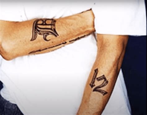 A Guide To 9 Eminem Tattoos and What They Mean