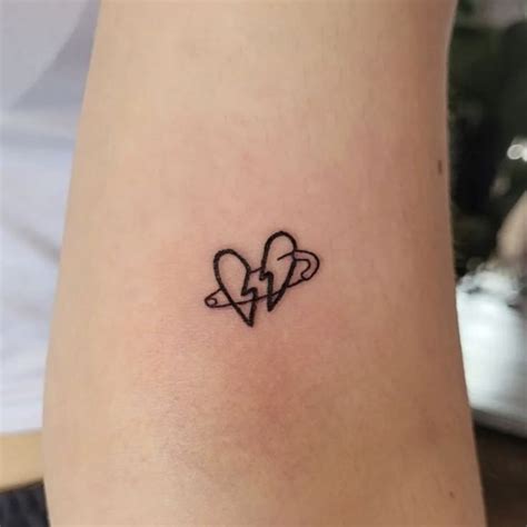 Small Broken Heart Face Tattoo: A Bold Statement or a Cry for Help? See the Trending Designs!