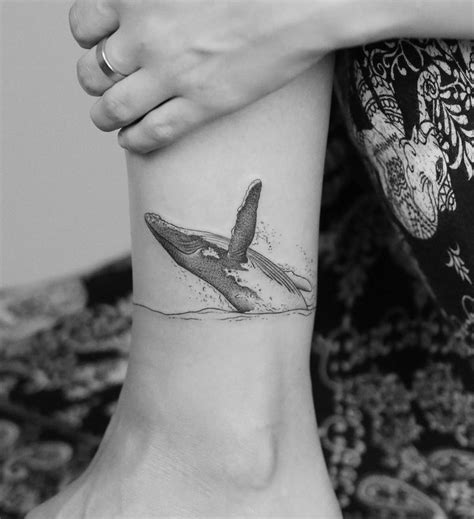 Humpback whale breaching by Minnie at Seventh Day Tattoo Studio. | Sleeve tattoos, Geometric ...