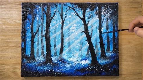 someone is painting a forest scene with blue colors