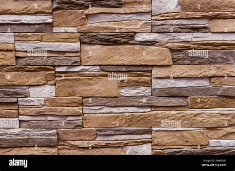 Texture of the stone wall. Panel of stones for finishing the facade of the building and interior ...