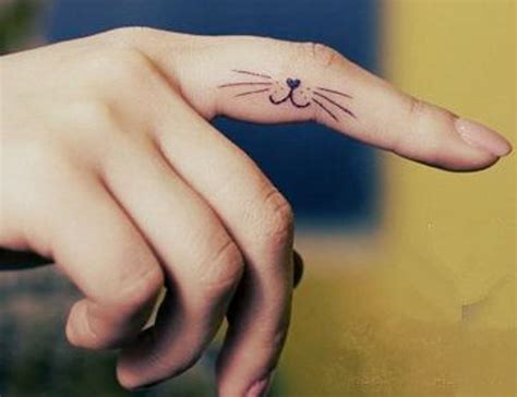 28 Elegant Cat Finger Tattoos - Finger Tattoo Designs