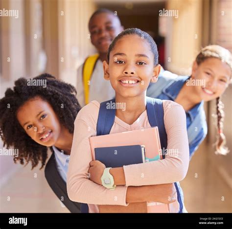 Education, children and portrait of friends at school together standing in the hallway for class ...