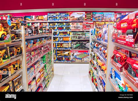 Shop toys. Toy store. Inside toy shop. Rows of shelves with toys ...