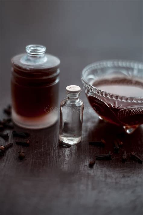 Clove Face Mask for Prevention Against Acne and Pimples on Wooden Surfaces in a Glass Bowl Along ...